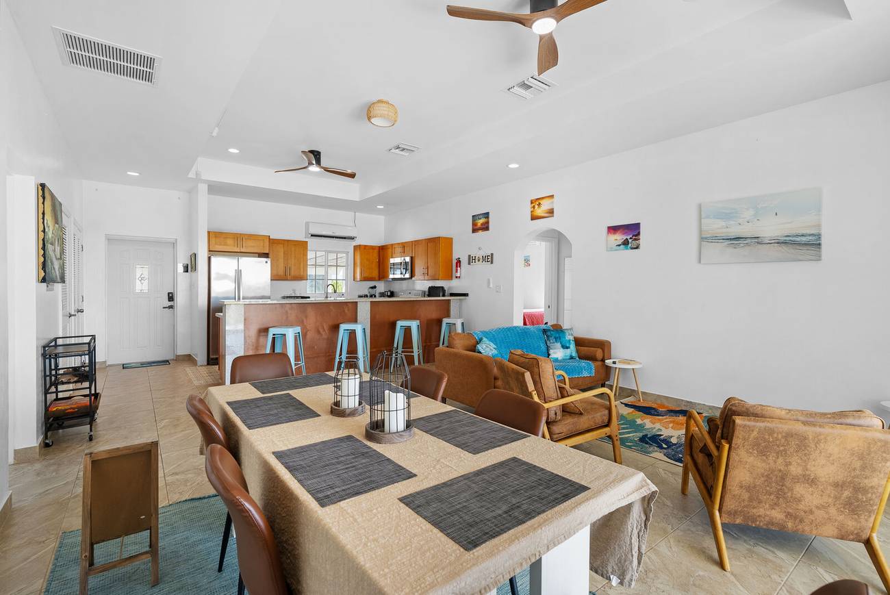 Breakfast bar with stools beside the kitchen