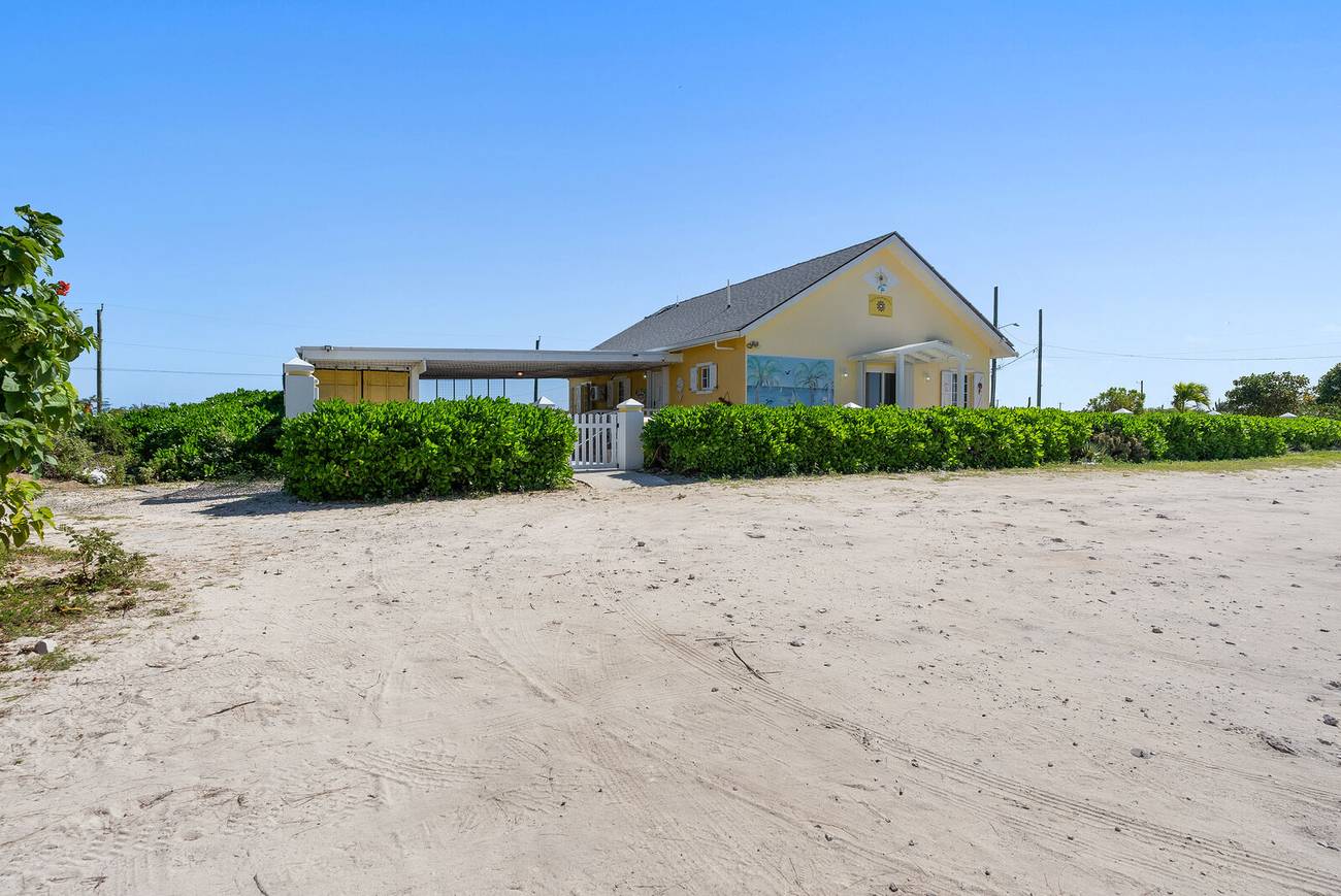 The villa seen from the white sand of Pillory Beach